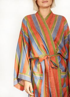 Step into our super-soft, richly hued, 100% cotton long robe in Soak, a soothing blend of blue, red, and green. Ethically handwoven on looms in India, this robe keeps you cozy and cool with stripes that stand out. Complete your after-bath look with the matching hair wrap, scrunchie, and make-up bag. It's worth getting out of the tub for, we promise. Product Details: 100% cotton Unisex, one size: 49" length, 27" shoulder (across back), 28" waist (across back), 14" drop sleeve Fits up to size US d Bathrobes For Women, Hair Towel Wrap, Bath Robes, Linen Robe, Djerf Avenue, Red Dress Makeup, Haikou, Linen Summer, Hair Wraps