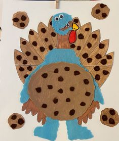 a turkey made out of cookie cookies on a white sheet of paper with brown dots