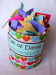 a can filled with lots of different colored paper hearts on it's sides and the words can of dates