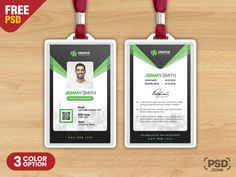 two id cards with lanyards attached to them on a wooden surface, one is green and the other is black