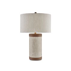 a table lamp with a white shade on top and brown trim around the lampshade