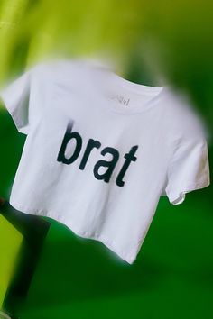 Bumpin' that in this Charli XCX Brat graphic baby tee. Designed in a slim & cropped fit so when you’re looking in the mirror you like what you see. Only at Urban Outfitters. Features Charli XCX Brat graphic baby tee Fitted graphic tee Soft and stretchy knit Crew neckline with short sleeves Brat graphic across the chest Slim fit Cropped length Easy pull-over style UO exclusive Content + Care 100% Cotton Machine wash Imported Size + Fit Model in Green is 5'9" and wearing size Small Measurements taken from size Small Chest: 32" Length: 16.5" | Charli XCX UO Exclusive Brat Graphic Baby Tee in White, Women's at Urban Outfitters Face Wax, Looking In The Mirror, Graphic Baby Tee, Baby Graphic Tees, Charli Xcx, Home Lifestyle, Look In The Mirror, Small Chest, Mens Clothing