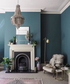 a living room with blue walls and a fireplace