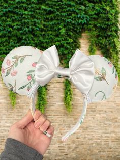 Floral Mouse Ears 🎀These ears are made on 1in headbands (standard to what's in the parks and most other small shops) fits adults and most children like in the parks ☺️ 🎀The headbands are wrapped in fabric and ears are stuffed. And the ears are sewn 🧵 🎀 Slight variations may occur as each pair are handmade. 🎀 For frequently asked questions and sizes check FAQ section. 🎀More ear designs can be found here: https://www.etsy.com/shop/Onegirlsdreamco?ref=simple-shop-header-name&listing_id=1412185586 🎀If you need your ears sooner I do offer expedited and overnight shipping for an extra cost. Just add the listing to your cart at checkout. All other orders with free shipping will be shipped USPS. If you do need your ears by a certain date though please write it in the notes field of the orde Custom Minnie Ears, Novelty Adjustable Headband With Ears, Adjustable Novelty Headband With Ears, Whimsical Adjustable Cat Ears Headband, Gift Headband With Ears, Adjustable Bunny Ears Headband, Cute Adjustable Ears Headband, Adjustable White Cat Ears Headband, Cute Adjustable Bunny Ears Headband