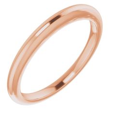 a rose gold wedding ring on a white background