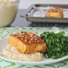 a plate with some food on top of it next to a bowl of oatmeal