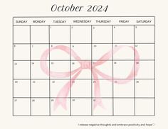 a calendar with a pink bow on it and the word october in red, is shown