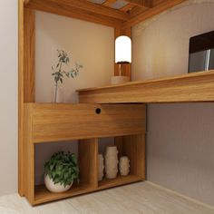 a wooden shelf with some vases and a potted plant on top of it