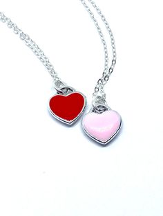 Description This tiny heart necklace is minimalistic and beautiful! Choose a pink or red heart as a symbol of your love that she can wear all the time. The heart hangs on a delicate sterling silver chain. Just choose the length. This necklace would make a lasting and memorable gift for Valentine’s Day, an anniversary, a birthday or anytime you want to let someone know they are loved! Connect Let’s stay in touch: Sign up for my VIP list for coupons, to be the first to see new releases and to be e Friendship Necklace With Heart Pendant And Charm, Friendship Necklace With Heart Pendant, Heart-shaped Friendship Necklaces With Adjustable Chain, Heart-shaped Adjustable Chain Necklace For Friendship, Heart-shaped Friendship Necklace With Adjustable Chain, Friendship Heart Necklace With Adjustable Chain, Valentine's Day Silver Charm Necklace With Delicate Chain, Valentine's Day Necklace With Heart Charm For Friendship, Double Heart Charm Necklace For Friendship