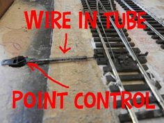 a train track with the words wire in tube and point control on it's side