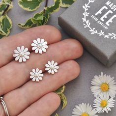 POSTAL DELAYS ARE COMMON DURING DECEMBER AND SADLY I CAN NOT GUARANTEE YOUR ORDER WILL ARRIVE IN TIME FOR CHRISTMAS.    These pretty sterling silver daisy stud earrings now come in two diameters 10mm (1cm) and 12mm.   They have been designed and handmade by me, completely from scratch using traditional silversmithing techniques in my Sussex (UK) workshop.    The daisies are hand pierced (sawn) from sterling silver sheet metal using a super fine jewellers saw.   The daisy centres are also textured by hand and are then soldered in place.  The 11mm sterling silver ear posts are soldered centrally on the back and supplied with lovely flower scroll push backs.      Lots of gorgeous matching daisy jewellery is available in my shop.   All pieces are carefully tissue wrapped, secured with ribbon a Hand Piercing, Daisy Jewelry, Daisy Studs, Jewellery For Women, Flower Pendant Necklace, Matching Jewelry, Sterling Silver Flowers, Floral Jewellery, Sheet Metal