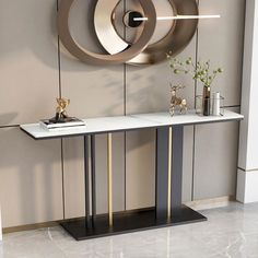 a modern console table with an abstract circular design on the wall behind it and vases