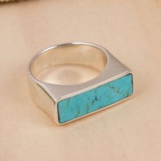 Gleaming with a high-polish finish a simple band circles the finger and forms a signet at the front of this ring from Mexico. Taxco artisan Guillermo Arregui creates this beautiful ring featuring a rectangle of reconstituted turquoise. Ring Rectangle, Simple Band, Silver Signet Ring, Accessories Style, Sterling Silver Hoop Earrings, Cat Earrings, Sterling Silver Hoops, Beautiful Ring, Jewelry Packaging