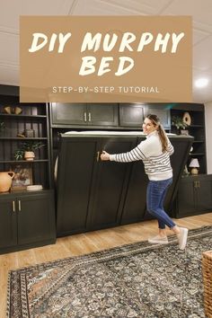 a woman standing in front of a bed with the words diy murphy bed on it