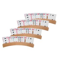 four playing cards are stacked on top of each other in the shape of an arch