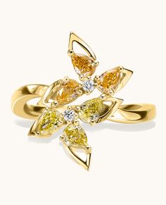 This ring exudes strength and boldness, featuring a striking six-petal flower crafted from fancy color diamonds, making it the ultimate statement piece. Elegant Luxury Flower Ring With Pave Setting, Luxury Gold Flower Cluster Ring, Luxury Flower Shaped Birthstone Jewelry, Zierlicher Ring, Petal Flower, Bezel Ring, Wrap Ring, Wrap Rings, Fancy Color Diamonds