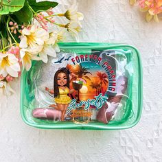 a glass tray with a cartoon character on it next to flowers and other items in the background