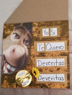 a close up of a piece of paper with words on it and a donkey's face