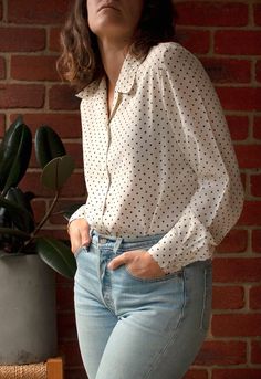 Lovely blouse. Very flattering and well made. Looks great tucked in or worn loose. - Size: 10 fits like: 10 - 12 brand: Millers circa: 1990s colour: white black fabric: Polyester condition: Excellent, no marks or stains.   53cm bust 53cm waist 63cm length (Shoulder seam to hem) Note: All measurements are taken flat. - Please check my FAQ section for more information on international shipping. - Every piece I stock has been pre-loved and is chosen for its unique qualities. Some are older than others but all have had a previous life and some have had many which ads to the item's history. Each piece is thoroughly checked and I take great care in describing the item accurately, noting any issues that may detract from the wearability of the garment.  My pieces are sold AS IS. This garment has b Previous Life, White Cream, Black Fabric, Womens Clothing Tops, Vintage 90s, White Black, Polka Dot, Sleeve Blouse, Blouses For Women