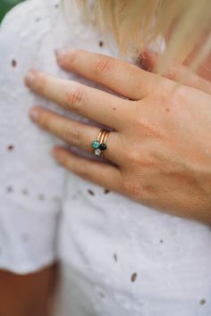 The Tiny Round Gemstone Stacking Ring are sold individually and shown here in turquoise, specularite (black), and mother of pearl.  Can be made with any crushed gemstone of your choice.  Gold plated over pewter with a slightly hammered look.  Sizes 6 and 7 available. Gold Turquoise Stackable Ring, Gold Stackable Turquoise Ring For Anniversary, Stackable Gemstone Rings For May Birthstone, Adjustable Gold Stackable Emerald Ring, Gold Stackable Turquoise Promise Ring, Adjustable Stackable Gold Emerald Ring, Everyday Stackable Gemstone Rings For May Birthstone, Gold Turquoise Ring Birthstone For Gift, Stackable Adjustable Emerald Ring For Everyday