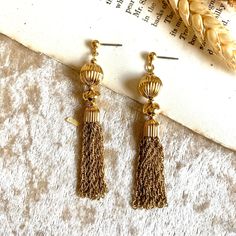 7.5cm #tassel #earrings #vintage #vintageearrings 👀 Please read before purchasing 📏 Check the measurements before buying as each item is different. 🔍 Please note that vintage or secondhand items may have signs of used and small imperfections, feel free to ask more details. 🖤 No return / refunds. Gold Tassel Dangle Earrings For Formal Occasions, Gold Dangle Tassel Earrings For Formal Occasions, Formal Dangle Tassel Earrings With Latkans, Formal Gold Dangle Tassel Earrings, Gold Brass Tassel Earrings, Formal Dangle Tassel Earrings, Gold Tassel Drop Earrings For Formal Occasions, Gold Tassel Earrings For Formal Occasions, Elegant Gold Brass Tassel Earrings