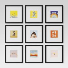 six black framed pictures hanging on the wall in front of a white wall with multiple frames