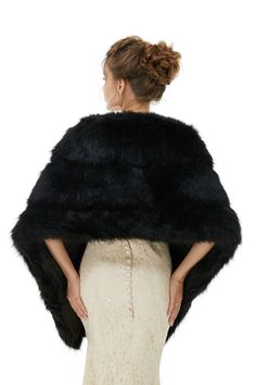 a woman is wearing a black fur stole