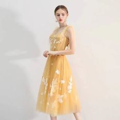 Summer Tulle Dress For Banquet, Spring Banquet Dress With Tulle Skirt, Spring Banquet Tulle Skirt Dress, Sleeveless Tulle Midi Dress For Prom Season, Spring Knee-length Tulle Evening Dress, Yellow Tulle Dress For Spring, Spring Yellow Tulle Dress, Yellow Sleeveless Organza Dress, Tulle Tea-length Dress For Prom Season