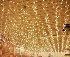 the ceiling is decorated with lights and decorations