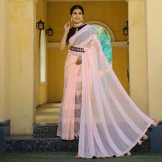 Light Peach colored saree is made from georgette fabric which is highlighted with zari striped weaving work as shown. comes along with embroidered rangoli silk blouse which you can customise as per your design/style with embroidered belt. Occasion - You can wear this saree for parties, functions and events. Note:- the actual product may differ slightly in color and design from the one illustrated in the images when compared with computer or mobile screen. Measurements: Saree : Georgette : 5.5 Mt Festive Georgette Pre-draped Saree With Border, Bollywood Georgette Saree With Border, Peach Georgette Dupatta With Pallu, Bollywood Style Georgette Saree With Border, Traditional Pre-draped Georgette Saree With Border, Wedding Pre-draped Georgette Saree With Border, Peach Georgette Traditional Wear With Pallu, Semi-stitched Pink Blouse Piece With Border, Peach Semi-stitched Saree For Navratri