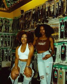 two women standing next to each other in a store