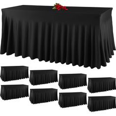 black table cloths with red roses on top