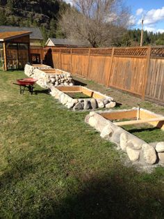 an outdoor garden area with rocks and grass