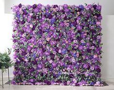 a large purple flowered wall in front of a white wall