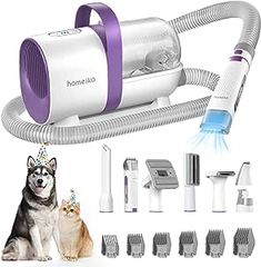 a dog is sitting next to a blow dryer and hairdryer with several attachments