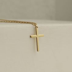 Showcase your faith with our Cross Pendant Necklace. The perfect gift for confirmation, christening, or any special occasion. Made for women who want to make a statement of their belief in a stylish and elegant way. Get one for yourself or a loved one today! Pendant width: 10 Millimeters; Pendant height: 16 Millimeters Please note that we also offer matching Cross Bracelet in our shop! Classic 14k Gold Cross Necklace For Gift, Classic 14k Gold Cross Necklace As Gift, Classic Crucifix Jewelry For First Communion, Minimalist Cross Pendant Necklace For First Communion, Classic Cross Pendant Jewelry For First Communion, Elegant Personalized Crucifix Jewelry, Classic Gold Jewelry For First Communion, Classic 14k Gold Jewelry For First Communion, Minimalist Cross Jewelry For First Communion