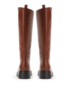 Crafted from exceptionally soft calfskin leather and featuring a sleek silhouette, these Italian riding boots deliver enduring style and quality. With their rounded toe and sturdy square heel, the boots exemplify luxurious design while providing reliable support. Fully leather lined for breathability and comfort, they come in your choice of versatile solid colors to complement any ensemble. For those seeking boots that beautifully stand the test of time, these made-in-Italy classics are a sophis Tall Leather Platform Boots For Work, Modern Knee-high Calf Leather Platform Boots, Modern Knee-high Leather Boots, Leather Mid-calf Boots With Lug Sole For Work, Modern Calf Leather Knee-high Boots For Fall, Tall Leather Boots For Work, Knee-high Platform Boots With Lug Sole For Work, Fall Workwear Knee-high Boots With Lug Sole, Brown Calf Leather Platform Boots For Work