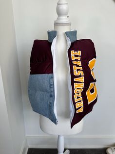 Do you have a favorite sports team or college? I'll make you a one of a kind puffer vest from a jersey, jacket, flag, etc. The process 1. Order a custom puffer vest 2. Select - "I'll send you the items" if you plan to use items you have or "source for me" if you want me to find the items. Please purchase the add on option for me to source the items for you. 3. I'll email you with instructions on how to get your items to me or we will talk about a design so I can source the items for you. 4. Proc Sporty Winter Outerwear For Team Events, Fitted Sporty Vest For Sports Events, Sporty Vest For Sports Events, Womens Best, Vest Womens, Jersey Jacket, Womens Jackets, You Want Me, Puffer Vest