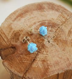 These beautiful 2 pcs of Rose flower in gentle light blue opal create a delicate yet noticeable pair of stud earrings. The opal stones are carved to a rose flower shape. They are set in a flower looking sterling silver cups so that the floral theme is complete. The earrings have two sterling silver closures. Perfect as a gift for your bridesmaids! Size of each flower: 8X8 mm Color: Light blue opal * Also available in white opal - as seen in the last photo: https://etsy.me/2GK1E68 Please note tha Blue Flower Earrings For Wedding, Dainty Blue Earrings For Wedding, Blue Flower Shaped Earrings For Wedding, Elegant Light Blue Flower Earrings For Gift, Delicate Blue Flower Earrings For Wedding, Blue Wedding Jewelry With Flower Charm, Light Blue Flower Jewelry For Wedding, Light Blue Flower Earrings Gift, Light Blue Flower Shaped Earrings For Gift