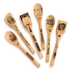 six wooden spoons with writing on them and one has a fork in the middle