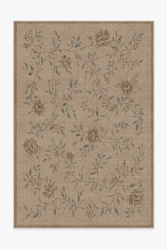 a beige rug with flowers and leaves on it