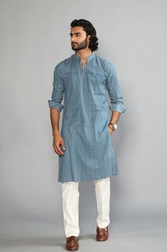 This is a bespoke product, specially crafted for you.  Crafted in Chinese Collar and Full Sleeves Available with a Cotton Pajama in White, It has a hand-block printed design all over it which makes it best outfit for your Wedding Function, Diwali, Eid, Durga Pooja and Cocktail Parties. Do note: Footwear shown in the image are also made to order and can be added separately, but it takes 15 days processing time.  (Slight variation in actual color vs. image is possible) Indigo Wedding Sets For Diwali, Cotton Block Print Wedding Sets, Wedding Cotton Sets With Block Print, Wedding Cotton Block Print Sets, Wedding Straight Kurta With Block Print, Cotton Kurta With Block Print For Wedding, Cotton Block Print Kurta For Wedding, Block Print Sets For Wedding And Eid, Blue Bandhani Print Sets For Eid