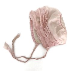 Antique Pink Silk Rosette Baby Bonnet. This beautiful, soft pastel pink baby bonnet is pink silk on the outside with pink silk ribbons, and soft padded white silk on the inside, and features a pink silk rosette on the ruffled brim.  In excellent antique condition, with no stains, in need of proper vintage cleaning. Please check the measurements. Measures Length from chin to the top of the head, laying flat: 7 inches Each ribbon tie: 11 inches width from chin to back of the head when laying flat: Elegant Adjustable Pink Bonnet, Vintage Cleaning, Vintage Childrens Clothing, Costume Inspo, Pattern Pictures, Baby Bonnet, Rose Pastel, Antique Pink, Ribbon Tie