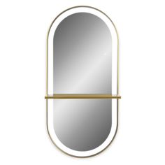 an oval mirror with gold trimming and a shelf on the side, against a white background