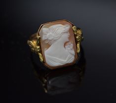 This is a 10K YG Cameo ring, Octagonal Shell cameo with decorations on sides, Circa 1930's, ring size 6, weight 3.5 grams, Nice vintge piece. Excellent condition. Stock #BB68R13 Solitaire Rings, Cameo Ring, White Band, Boston Ma, Blue Topaz Ring, Topaz Ring, Pink Tourmaline, Solitaire Ring, Blue Topaz