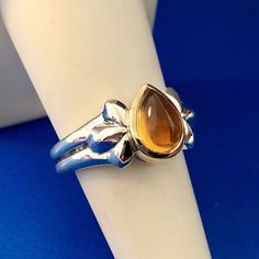 * Designer Signed 925 Sterling Silver 18k Yellow Gold Citrine Pear Cabochon Ring * Ring Size: 6.75 * Top Of Ring Measures: 1/2" X 1/2" * Height: 3/8" * Citrine Total Carat Weight: Approximately 1.50 Tcw * Ring Weight: 8.2 Tgw * Marked: Artist's Signature*925*18k * Condition: Great * S999 Cabochon Ring, Citrine Ring, Ring Ring, Womens Jewelry Rings, Sterling Silber, Yellow Color, Citrine, Pear, Jewelry Design