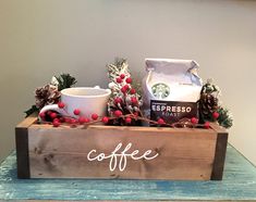 a wooden box filled with coffee sitting on top of a table