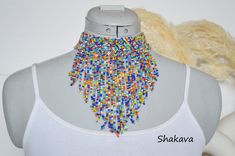 African fringe choker necklace beaded jewelry fancy necklace tribal jewelry handmade necklace African jewelry boho tribal accessories gift PRODUCT SPECIFICATIONS: Necklace length - adjustable. Fringe longest part - 14.0 cm. Materials - beads ADDITIONAL INFORMATION New and unworn: Yes Handmade in Kenya: Yes Other jewelry in my shop: https://www.etsy.com/shop/shakava Festival Beaded Bib Necklace, Bohemian Adjustable Beaded Bib Necklace, Adjustable Beaded Bib Necklace For Festivals, Bohemian Adjustable Bib Necklace With Colorful Beads, Adjustable Bohemian Bib Necklace With Colorful Beads, Festival Fringe Choker Necklace, Fringe Choker Necklace For Festival, Bohemian Adjustable Bib Necklace Choker, Adjustable Colorful Beads Bib Necklace For Festivals