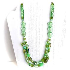 Lovely shades of minty green, khaki, peppermint green, sea foam green & more! This jewelry set is inspired by nature, specifically from the light green glass butterfly beads. A 2-layer beaded necklace from glass, foil, acrylic, czech glass, semi-precious stones & seed beads of different shapes & sizes. There are even leaf shaped beads to give the feeling of the butterflies in a garden. The necklace measures about 22.5 inches in length, with a 2 inch extension. There are 2 bracelets to match the Light Green Butterfly, Butterfly Beads, Layered Beaded Necklaces, Minty Green, Glass Butterfly, Green Butterfly, Green Sea, Black Necklace, Perfect Style