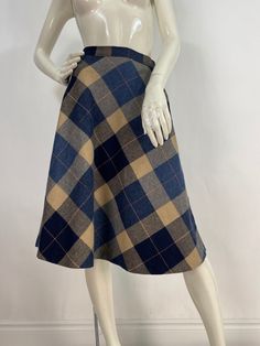 Plaid midi skirt, vintage midi skirt, size 26" waist  Measurements:  Waist 13"/hip 19"/bottom width (corner-corner)41"/length 26" Mannequin measurements:  5'8", bust 34", waist 25", hip 33" Please note that vintage clothing sizes can vary greatly.  The Measurements provided  are approximate and are taken lying flat.  I suggest taking a similar garment from your wardrobe and measure it while lying flat.  This way you can compare measurements.   Don't forget to enlarge the photos and take a closer Retro A-line Winter Skirt, Fitted Vintage Fashion Skirt For Spring, Fitted Skirt For Spring Vintage Fashion, Classic Full Skirt Bottoms For Fall, Fall Midi-length Lined Pencil Skirt, Fall Midi Length Lined Pencil Skirt, Fitted Midi Skirt For Fall, Spring Vintage Fashion Fitted Skirt, Classic Fall Midi Skirt